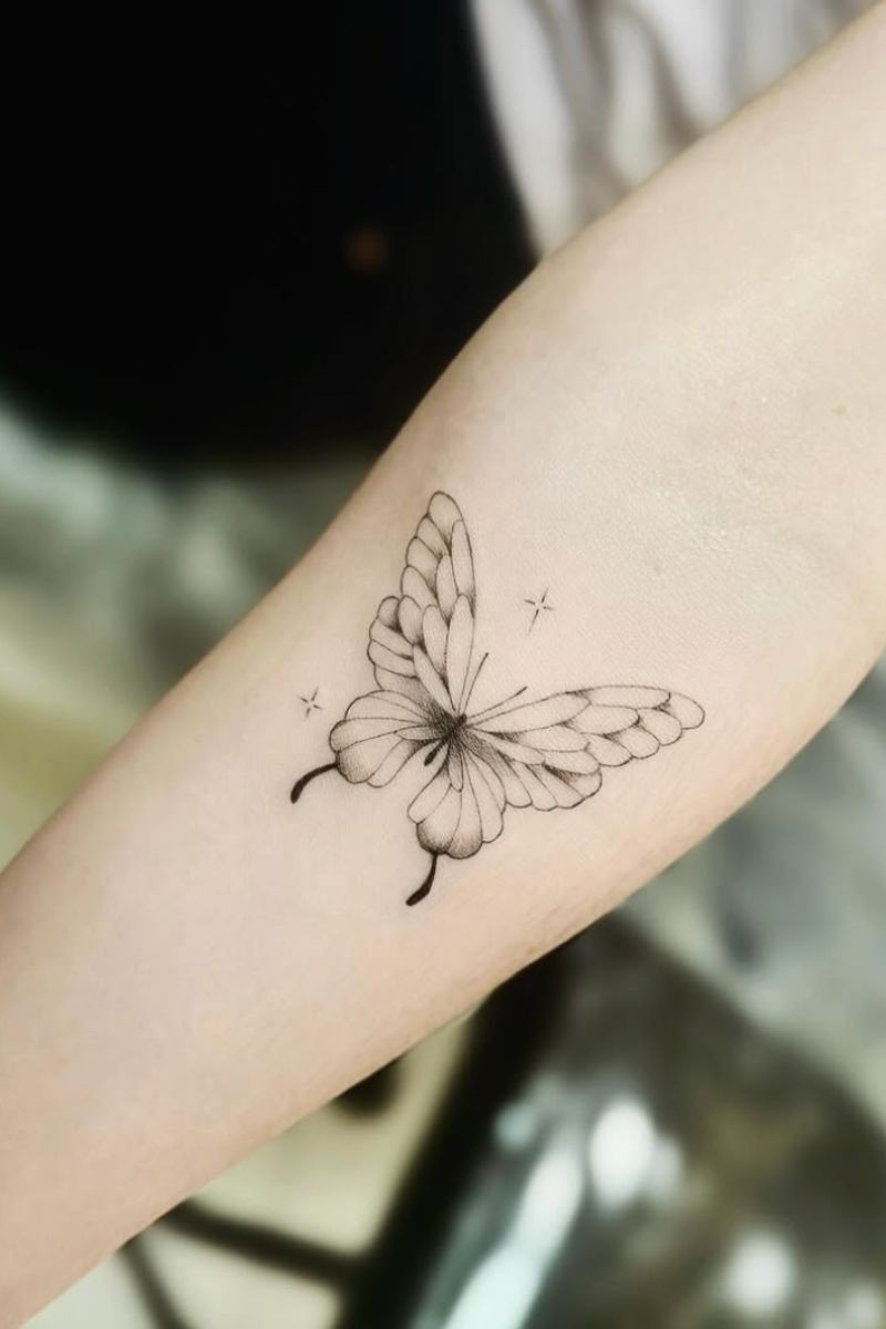 A cool butterfly tattoo with fine line work and shading