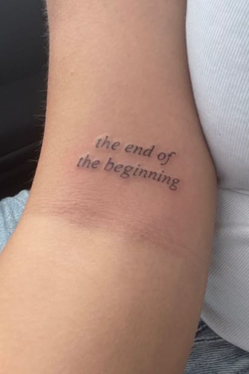 A tattoo that says the end of the beginning