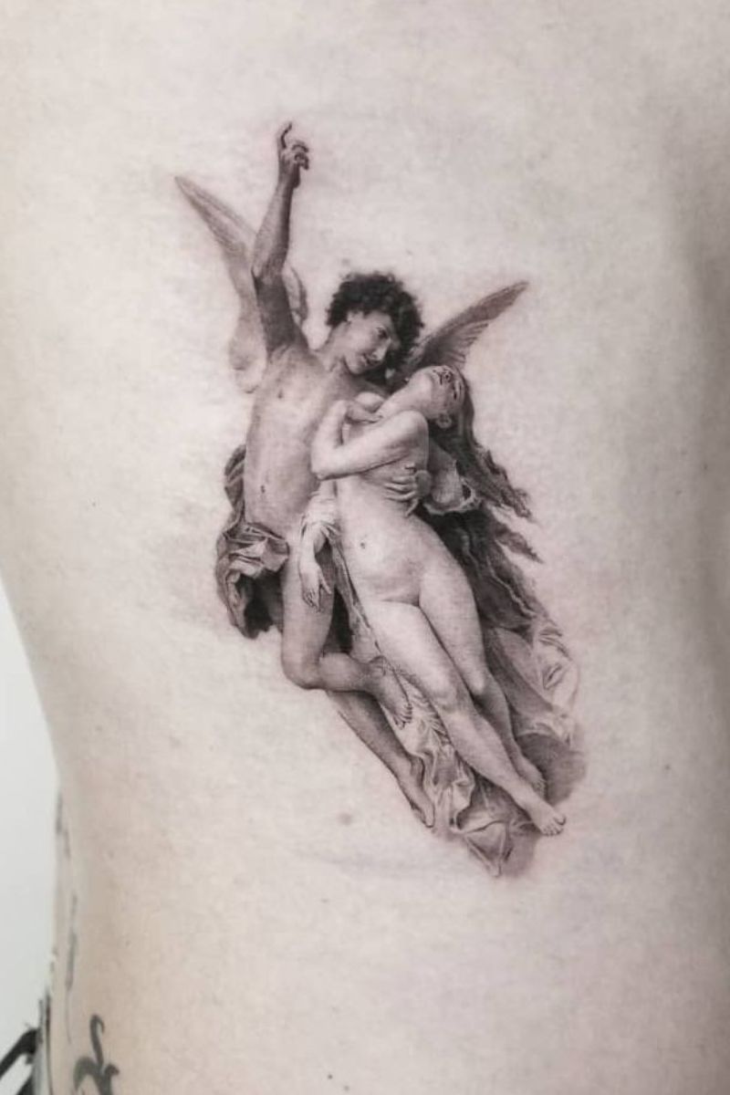 A realistic tattoo of an angel ascending with a woman