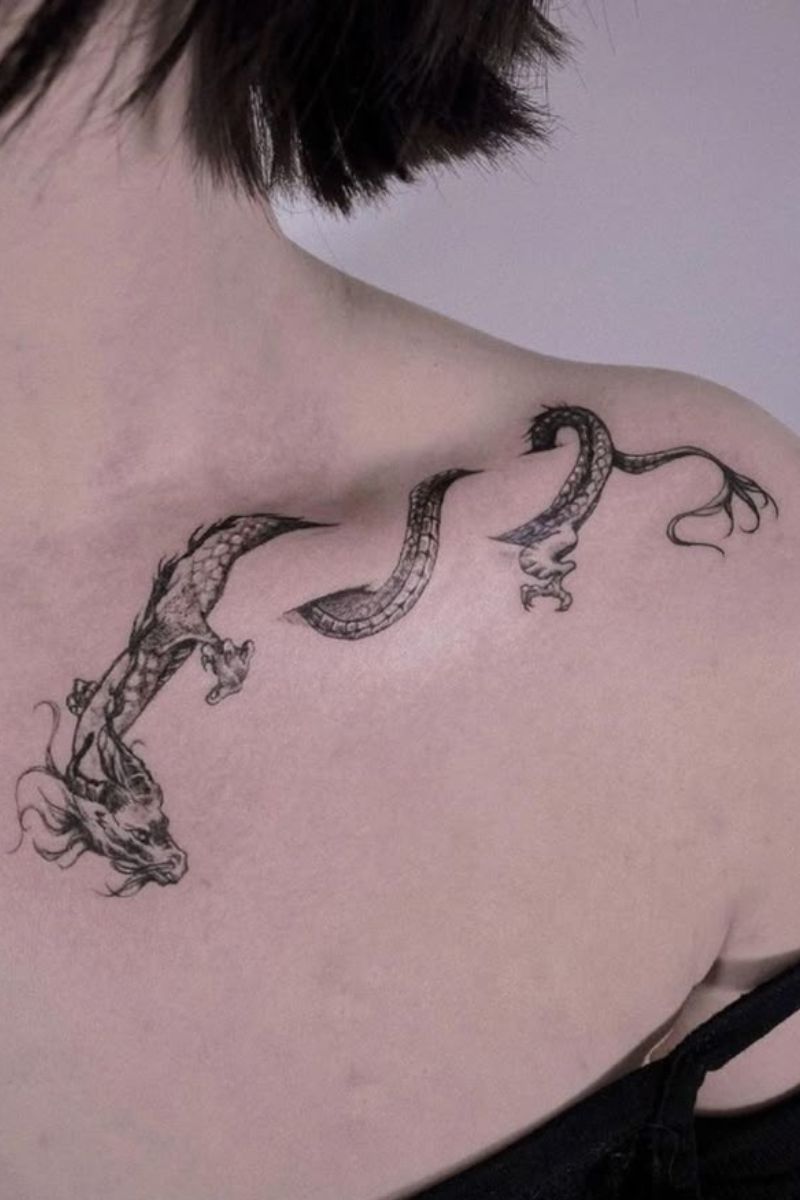 A wrapped collarbone tattoo of a dragon.