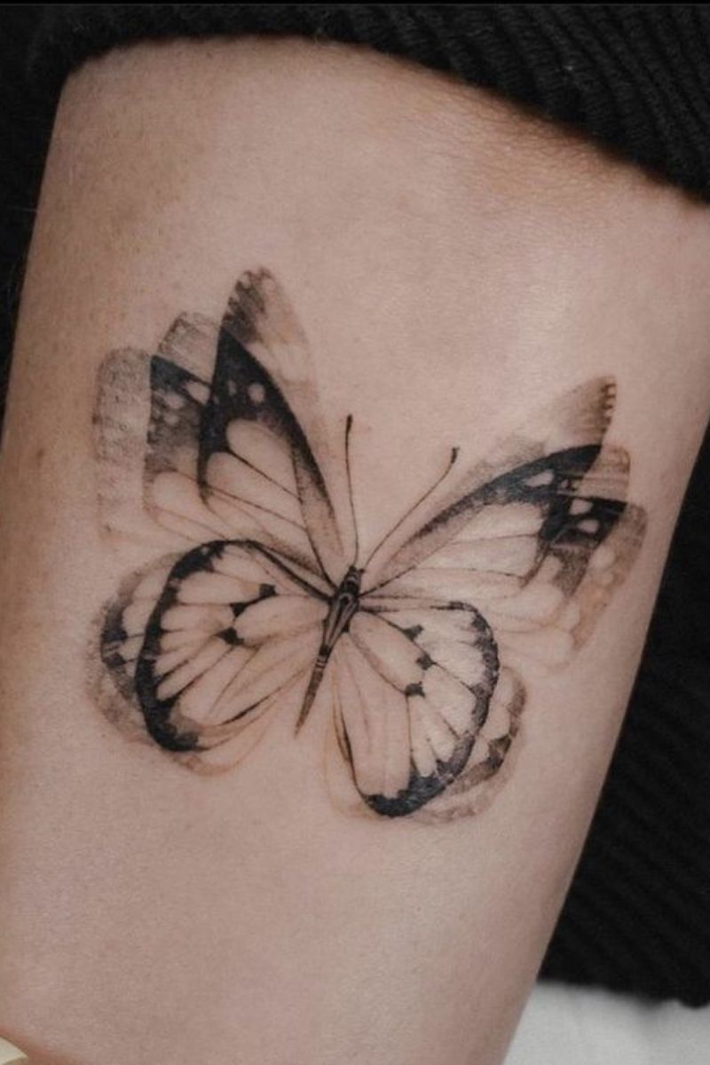 A tattoo of a butterfly in motion